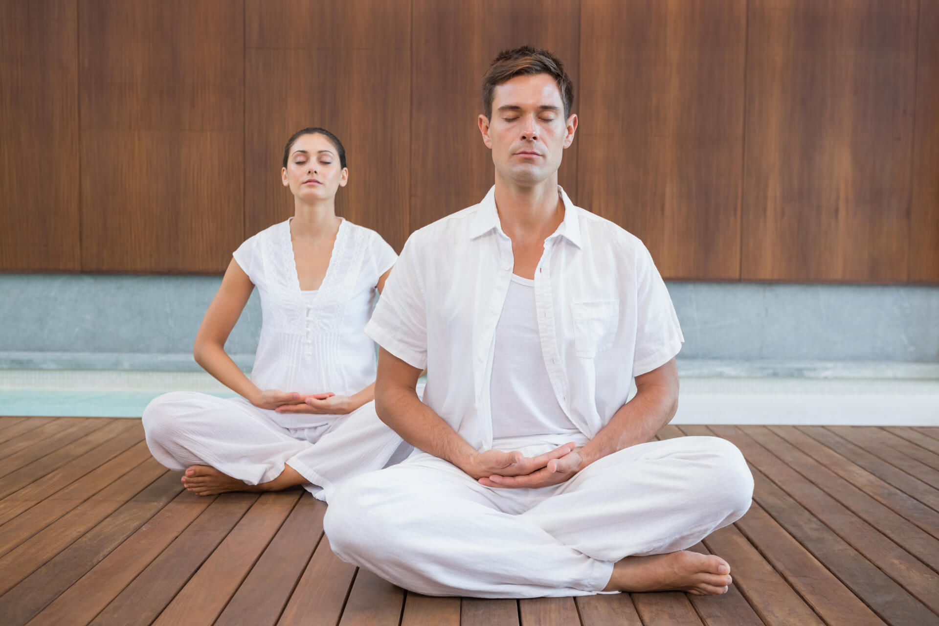 peaceful-couple-in-white-sitting-in-lotus-pose-tog-2025-04-03-02-32-53-utc
